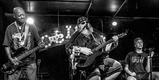 Dee Calhoun: Acoustically Godless